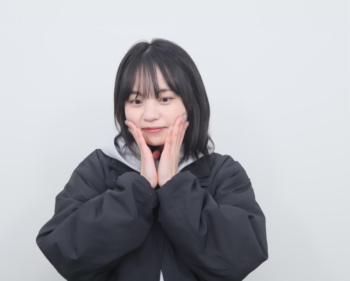 Wonji Chu portrait against a light background